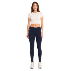 Spodnie damskie Lacoste sportowe treningowe legginsy granatowe. Niebieskie legginsy Lacoste, na lato, uniwersalny, bez wzorów, z elastanu, na fitness i siłownię. Za 357.00 zł.