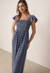 Niebieski Letni Kombinezon Casual z Wiskozy w Etno Haft z Falbankami Paninna. Niebieskie sukienki Born2be, na co dzień, na lato, l, bez wzorów, z tkaniny, boho, bez kołnierzyka, bez ramiączek, proste. Za 119.99 zł.