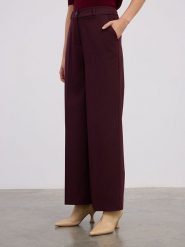 BGN Spodnie w kolorze bordowym rozmiar: 40. Czerwone spodnie materiałowe BGN, na imprezę, bez wzorów, z materiału, z podwyższonym stanem. Za 139.87 zł.