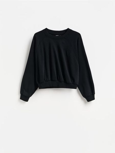 Gładka bluza - czarny. Czarne bluzy Reserved, l, bez wzorów, z bawełny, bez kaptura. Za 69.99 zł.