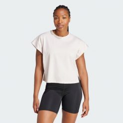 Koszulka Studio. Fioletowe bluzki Adidas, xs, bez wzorów, z materiału, sportowe, bez kołnierzyka, bez ramiączek. W wyprzedaży za 136.85 zł.