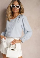 Jasnoniebieska Koszulowa Bluzka Retro z Ozdobną Koronką i Marszczeniem Udeviana. Niebieskie bluzki Renee, m, bez wzorów, z koronki, eleganckie, bez kołnierzyka, bez ramiączek. W wyprzedaży za 45.49 zł.