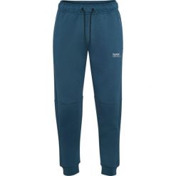 Spodnie dresowe z polaru Hummel Tech Regular. Niebieskie spodnie sportowe Hummel, bez wzorów, z dresówki, do piłki ręcznej. Za 304.00 zł.