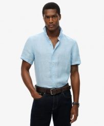 Superdry Koszula Vacation Linen krótki rękaw 100% len Sea Blue Chambray. Niebieskie koszule Superdry, s, bez wzorów, ze lnu, klasyczne, bez kołnierzyka, bez ramiączek. Za 322.70 zł.