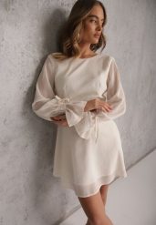 Beżowa Sukienka Vices Ozdobiona Transparentnymi Rękawami i Kropkami Celziva. Brązowe sukienki Renee, na co dzień, l, bez wzorów, z koronki, eleganckie, bez kołnierzyka, bez ramiączek, mini, dopasowane. Za 139.99 zł.