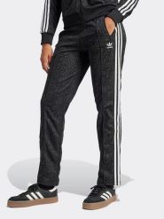 Adidas Spodnie dresowe w kolorze czarnym rozmiar: XS. Czarne spodnie dresowe Adidas, xs, bez wzorów, z dresówki. Za 174.02 zł.