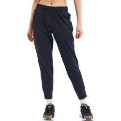 Spodnie sportowe damskie Under Armour Unstoppable Jogger. Czarne spodnie sportowe Under Armour, xl, bez wzorów, z dresówki, do biegania. Za 511.00 zł.