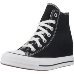 Kapcie CONVERSE CHUCK TAYLOR ALL STAR WEDGE PLATFORM Czarny. Czarne obuwie domowe Converse, bez wzorów, bez zapięcia. Za 368.99 zł.