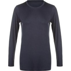 Damska koszulka termoaktywna z długim rękawem Athlecia Julee. Czarne bluzki Athlecia, bez wzorów, sportowe, bez kołnierzyka, bez ramiączek. Za 141.00 zł.