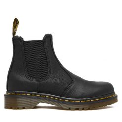 Sztyblety Dr. Martens. Czarne botki Dr. Martens, bez wzorów, bez obcasa, na płaskiej podeszwie, bez zapięcia. Za 989.99 zł.