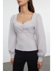 Trendyol Bluzka w kolorze białym rozmiar: 34. Białe bluzki Trendyol, bez wzorów, bez kołnierzyka, bez ramiączek. Za 60.99 zł.