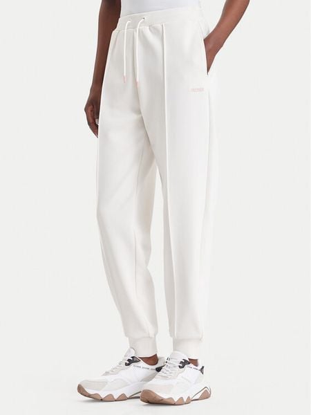 Guess Spodnie dresowe V6BB17 K6344 Kremowy Regular Fit. Białe spodnie dresowe Guess, l, z aplikacjami, z dresówki. Za 344.99 zł.