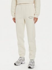 New Balance Spodnie dresowe WP43500 Beżowy Relaxed Fit. Brązowe spodnie dresowe New Balance, s, bez wzorów, z bawełny. Za 179.99 zł.