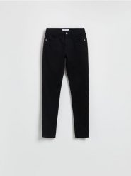 Jeansy slim mid rise - czarny. Czarne jeansy Reserved, bez wzorów. Za 99.99 zł.