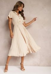 Beżowa Plisowana Rozkloszowana Sukienka z Paskiem Guzikami i Gumką w Talii Nelaika. Brązowe sukienki Renee, na co dzień, l, bez wzorów, eleganckie, bez kołnierzyka, bez ramiączek, midi, kopertowe. Za 109.99 zł.
