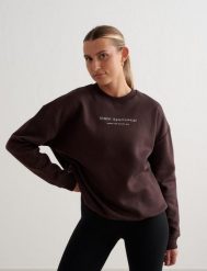 Damska bluza dresowa czesana, luźny krój Serif kakaowy brąz. Brązowe bluzy sportowe AIM'N, s, bez wzorów, z bawełny, bez kaptura. Za 339.00 zł.