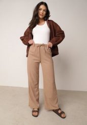 Beżowe Szerokie Spodnie z Teksturalnej Tkaniny z Wiązaniem w Pasie Agatia. Brązowe spodnie materiałowe Born2be, do pracy, m, bez wzorów, z jeansu, z podwyższonym stanem, długie. Za 59.99 zł.