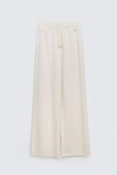 Spodnie damskie dresowe z szeroką nogawką kremowe Lunarap 102. Białe spodnie dresowe Big Star, l, bez wzorów, z dresówki. Za 179.99 zł.