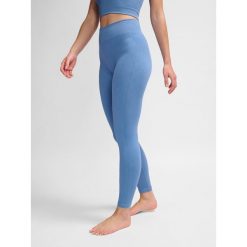 Damskie legginsy bezszwowe Hummel MT Adapt MW. Fioletowe legginsy Hummel, bez wzorów, z materiału. Za 167.00 zł.