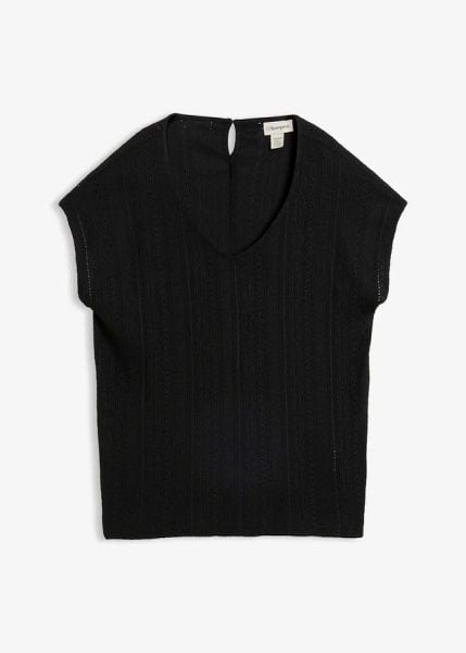 Bluzka w ażurowy wzór. Czarne bluzki bonprix, w ażurowe wzory, bez kołnierzyka, bez ramiączek. Za 34.99 zł.