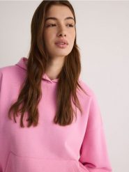 Bluza z kapturem - różowy. Czerwone bluzy Reserved, l, bez wzorów, z bawełny, z kapturem. W wyprzedaży za 59.99 zł.