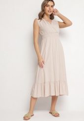 Beżowa Wiskozowa Sukienka o Kopertowym Kroju z Falbanką Uliria. Brązowe sukienki Born2be, na spotkanie biznesowe, l, bez wzorów, z wiskozy, eleganckie, bez kołnierzyka, bez ramiączek, midi, kopertowe. Za 64.99 zł.
