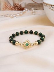 L'Atelier de Gaia Pozłacana bransoletka z tygrysim okiem i cyrkoniami rozmiar: onesize. Zielone bransoletki L'Atelier de Gaia, z cyrkonią, pozłacane. Za 45.45 zł.