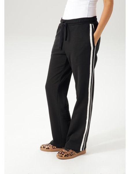 Aniston Spodnie dresowe w kolorze czarnym rozmiar: 36. Czarne spodnie dresowe Aniston, bez wzorów, z dresówki. Za 65.23 zł.