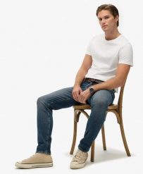Superdry Jeansy Slim Vintage z Bawełny Organicznej – Storm Blue. Niebieskie jeansy Superdry, z aplikacjami. Za 478.55 zł.