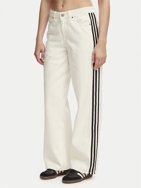 Adidas Jeansy Firebird KD2895 Beżowy Loose Fit. Brązowe jeansy Adidas, bez wzorów. Za 254.99 zł.