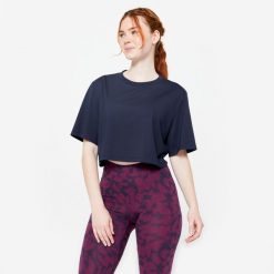 Koszulka damska Domyos Gym & Pilates crop top. Niebieskie topy NYAMBA, xs, bez wzorów, z bawełny, bez kołnierzyka, bez ramiączek. Za 49.99 zł.