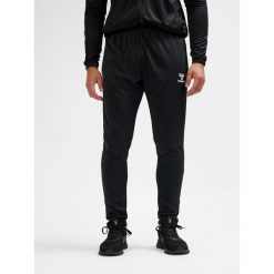 SPODNIE hmlESSENTIAL TRAINING PANTS. Czarne spodnie sportowe Hummel, l, bez wzorów, z dresówki, do piłki nożnej. Za 100.00 zł.