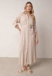 Beżowa Bawełniana Sukienka Koszulowa z Paskiem i Regulowanymi Rękawami Sadevia. Brązowe sukienki Born2be, do pracy, l, bez wzorów, z bawełny, biznesowe, bez kołnierzyka, bez ramiączek, maxi, koszulowe. Za 119.99 zł.