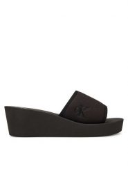 Calvin Klein Jeans Klapki Beach Wedge Slide Canvas YW0YW01725 Czarny. Czarne klapki Calvin Klein Jeans, bez wzorów, z jeansu, bez obcasa. Za 159.99 zł.