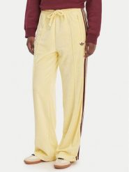 Adidas Spodnie dresowe Terry Towel Firebird KQ6662 Żółty Loose Fit. Żółte spodnie dresowe Adidas, l, bez wzorów, z bawełny. Za 348.99 zł.