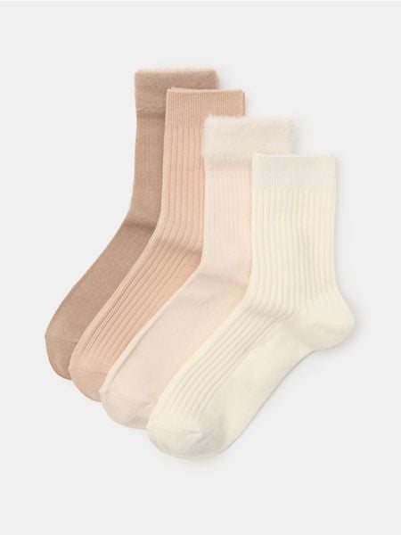 Długie prążkowane skarpety 4 pack - beżowy. Brązowe skarpety Sinsay, bez wzorów, prążkowane. Za 17.99 zł.