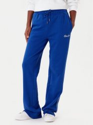 Guess Jeans Spodnie dresowe W5YB32 K68I4 Niebieski Regular Fit. Niebieskie spodnie sportowe Guess Jeans, s, z aplikacjami, z bawełny. Za 349.99 zł.