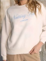 Bluza z napisem - kremowy. Białe bluzy Sinsay, l, bez wzorów, bez kaptura. Za 29.99 zł.