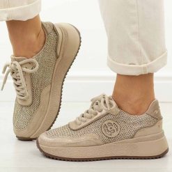 Złote skórzane sneakersy damskie Jezzi Ol39-5. Żółte obuwie sportowe Jezzi, na jesień, z jeansu, bez zapięcia. W wyprzedaży za 251.10 zł.