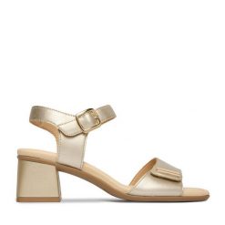 Sandały Remonte. Żółte sandały Remonte, bez wzorów, bez obcasa, na słupku, bez zapięcia. Za 379.99 zł.