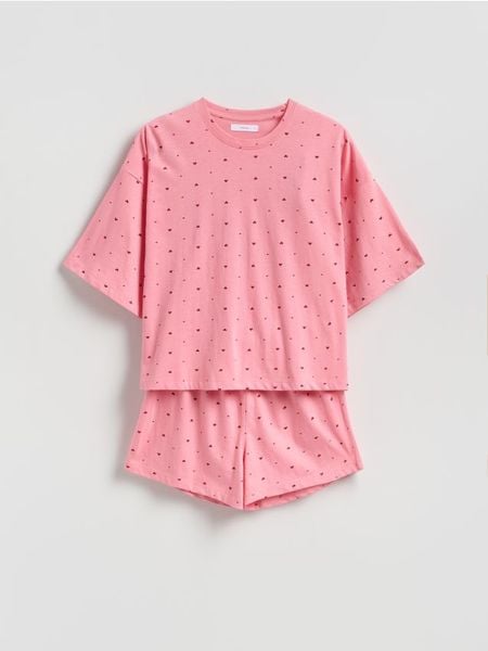 Dwuczęściowa piżama w serca - intensywny róż. Czerwone piżamy Reserved, bez wzorów, z bawełny, bez ramiączek. Za 59.99 zł.