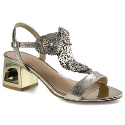 Złote Sandały Damiss Eleganckie Buty Damskie. Żółte sandały DAMISS, w ażurowe wzory, ze skóry, eleganckie, bez obcasa, na obcasie, bez zapięcia. Za 219.00 zł.