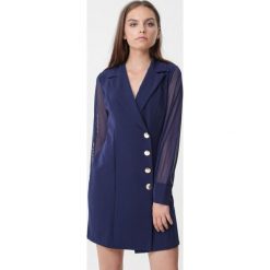 Granatowa Sukienka Nixie. Żółte sukienki Born2be, l, bez wzorów, klasyczne, bez kołnierzyka, bez ramiączek, mini, kopertowe. Za 89.99 zł.