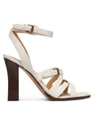 Guess Sandały FLJRAD LEA03 Kremowy. Białe sandały Guess, z aplikacjami, ze skóry, bez obcasa, na słupku, bez zapięcia. Za 719.99 zł.