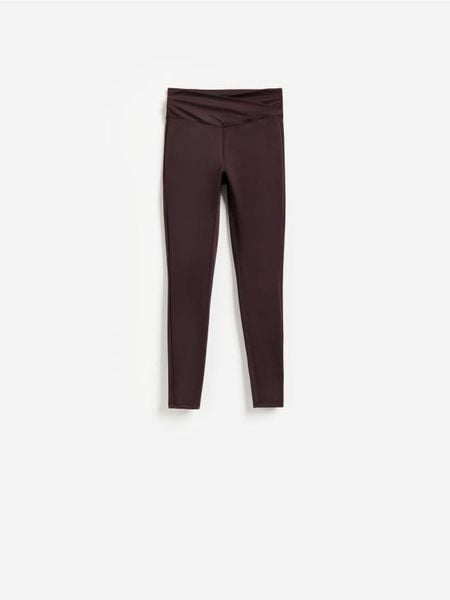 Gładkie legginsy - ciemnofioletowy. Fioletowe legginsy Reserved, l, bez wzorów, z dzianiny. Za 89.99 zł.