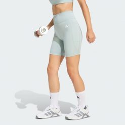 Krótkie legginsy Optimé Essentials Stash Pocket 7-Inch. Zielone legginsy Adidas, bez wzorów, z podwyższonym stanem, na fitness i siłownię. Za 149.00 zł.