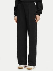 Guess Spodnie dresowe V6BB05 K6265 Czarny Regular Fit. Czarne spodnie dresowe Guess, m, z aplikacjami, z dresówki. Za 394.99 zł.