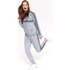 SPODNIE DŁUGIE DAMSKIE LUŹNE. Szare spodnie dresowe TROLL, na lato, m, bez wzorów, z dresówki. W wyprzedaży za 39.99 zł.