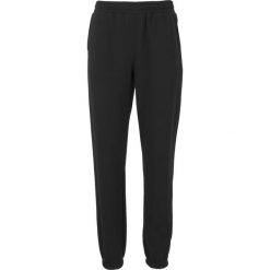 Damskie spodnie dresowe Athlecia Ruthie. Czarne spodnie dresowe Athlecia, bez wzorów, z bawełny, z standardowym stanem, do biegania. Za 164.00 zł.