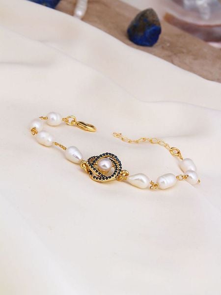 L'Atelier de Gaia Pozłacana bransoletka z elementami ozdobnymi rozmiar: onesize. Białe bransoletki L'Atelier de Gaia, z cyrkonią, pozłacane. Za 73.93 zł.